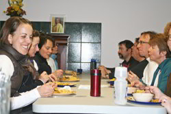 Text Box: photo of group sharing a meal