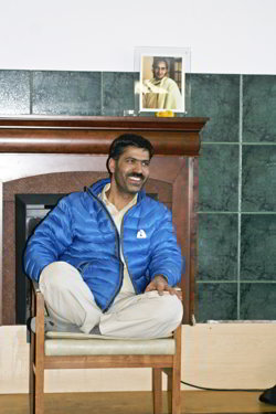 Text Box: Photo of Panditji sitting in chair