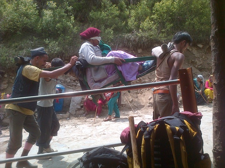Woman being carried by porters