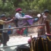 Woman being carried by porters