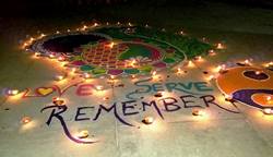 Oil lamps with message "Love Serve Remember"